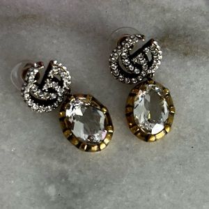 Authentic Gucci earrings.  Never worn.  Comes with purple pouch.
